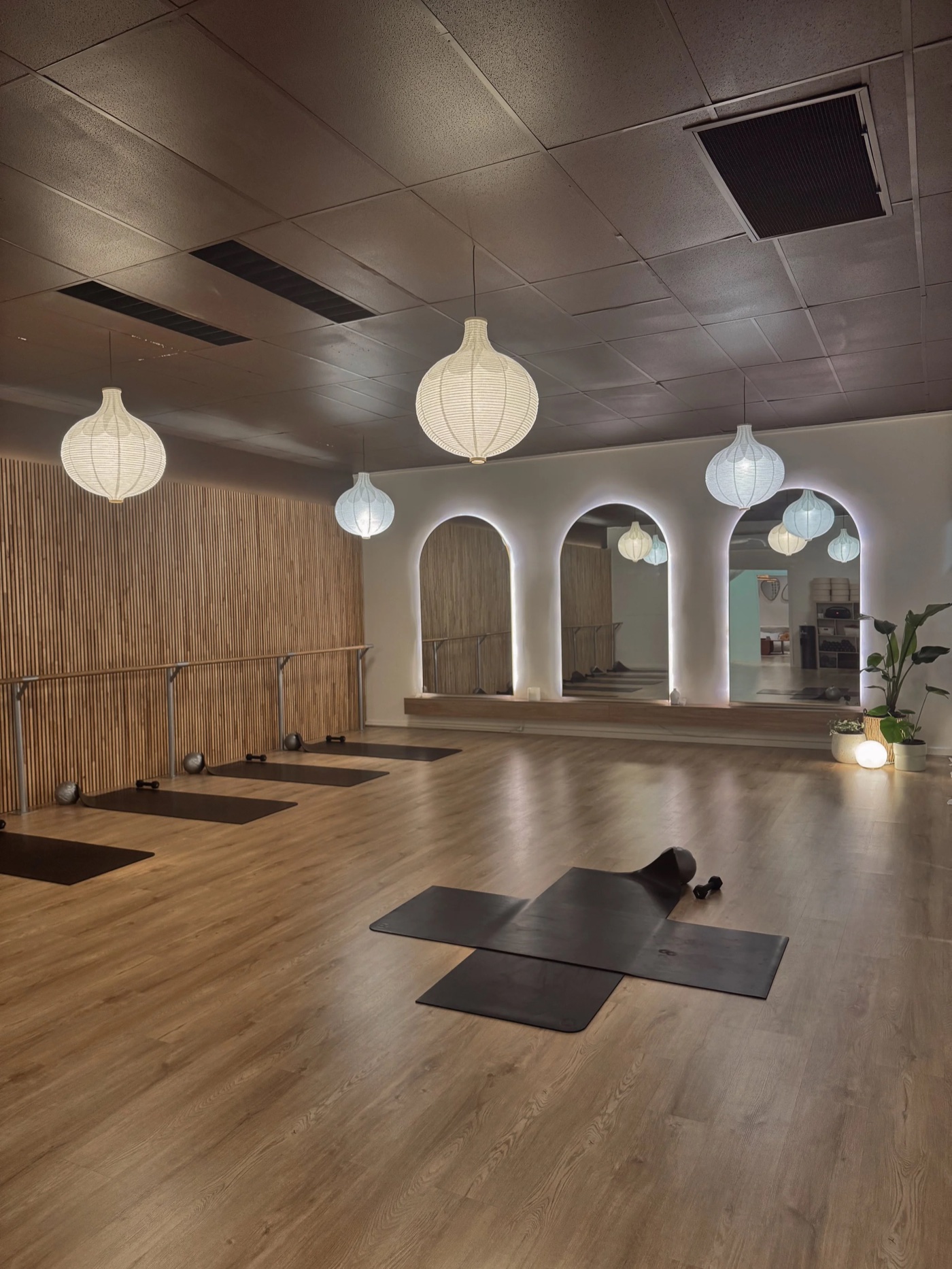 Inside Out Studio in Goulburn, with timber floors, exercise mats and softly lit mirrors